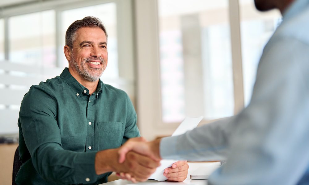 Celebrating Entrepreneurship in the Insurance Industry during National Entrepreneurs Month -man shaking hands